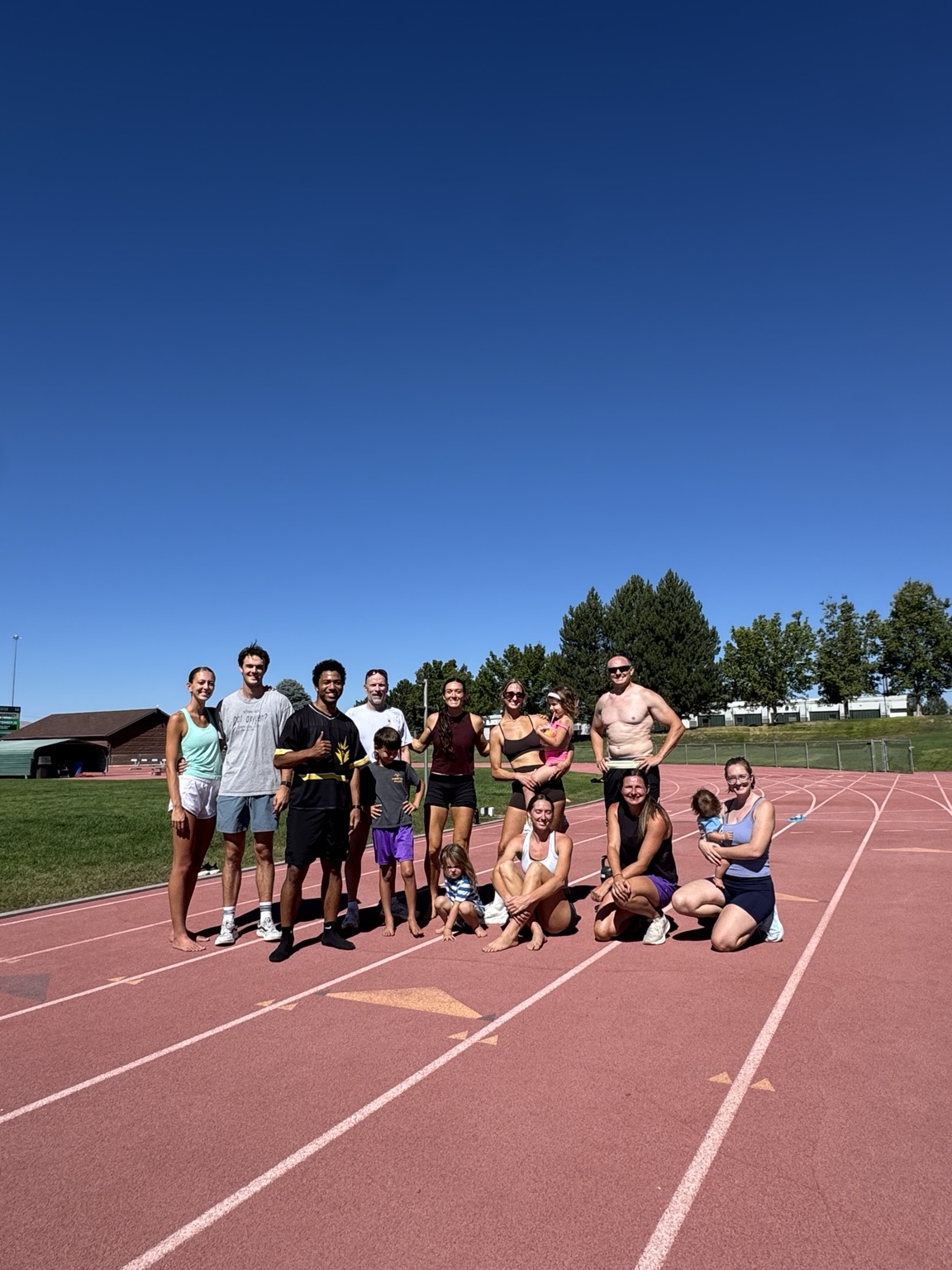 Kōtare Track Club group together at the track